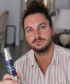 Man holding Particle Face Cream bottle