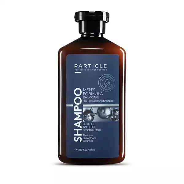 Brown bottle of Particle Men's Shampoo with blue label.