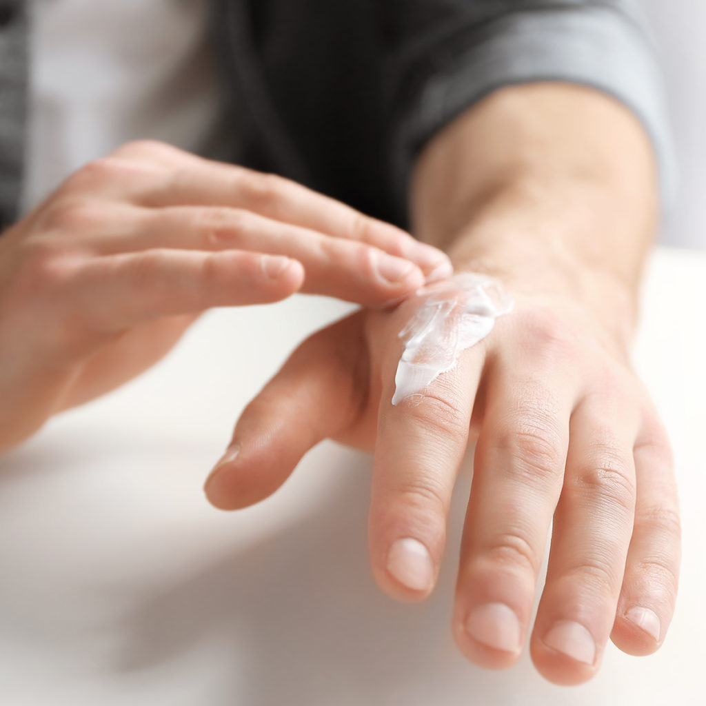 Man applying Particle Hand Cream 2